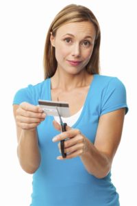 mid-adult-woman-cutting-credit-card-000022124363_xxxlarge